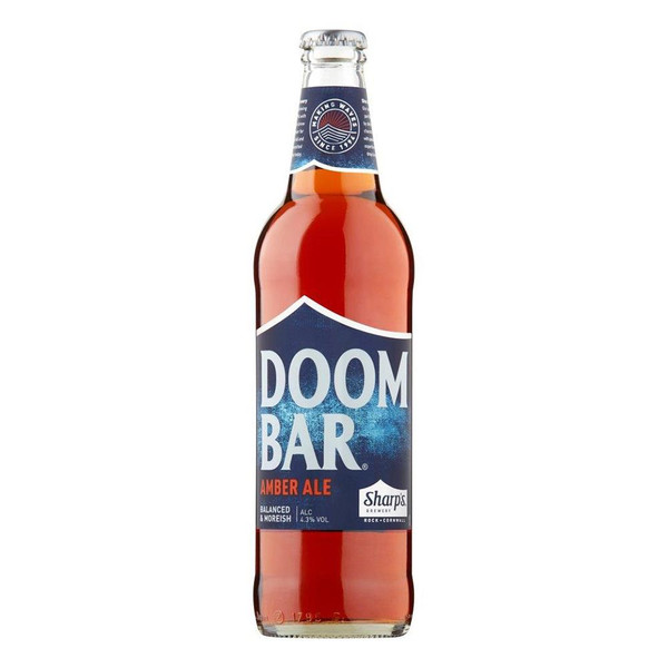 A single amber-hued bottle of Sharps Doom Bar shows a depiction of a rocky shoreline and a setting sun with Doom Bar in bold.