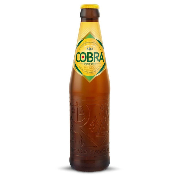 A single amber-hued bottle with a yellow crown cap and embossed Cobra detailing around the body, the Cobra name is in green.