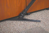 The sidewinder under a cabinet cleaning up dirt.