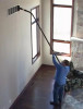 Someone using a reach want to clean a vent high above their head.