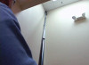 Someone using a reach want to clean a ceiling high above their head.