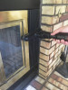 Person cleaning a fireplace with 8 inch wide Sidewinder brush.