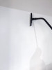 Person using Reach with Sidewinder brush to clean wall.