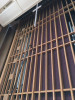 Reach with Sidewinder brush cleaning religious wooden mural.