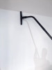 Person using Reach with Sidewinder brush to clean wall.
