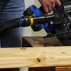 A photo of an Antistatic Quick Click adapter connected to a blue circular saw and an Antistatic hose.