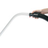 Person holding vacuum hose with S-wand attached.