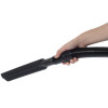 Person holding vacuum hose with crevice tool attached.