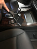 Dust brush cleaning console in car.