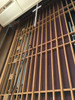 Reach with Sidewinder brush cleaning religious wooden mural.