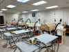 Workshop with FEIN vacuums, 12 gallon Quick Click separator buckets, and Quick Click hose adapters attached to sanders on multiple tables.