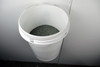 Grass seed in wall mounted bucket.