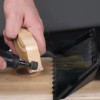 Dust from dremel tool being vacuumed into gulper tool.