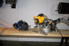 Quick Click adapter hose being switched between two power tools.