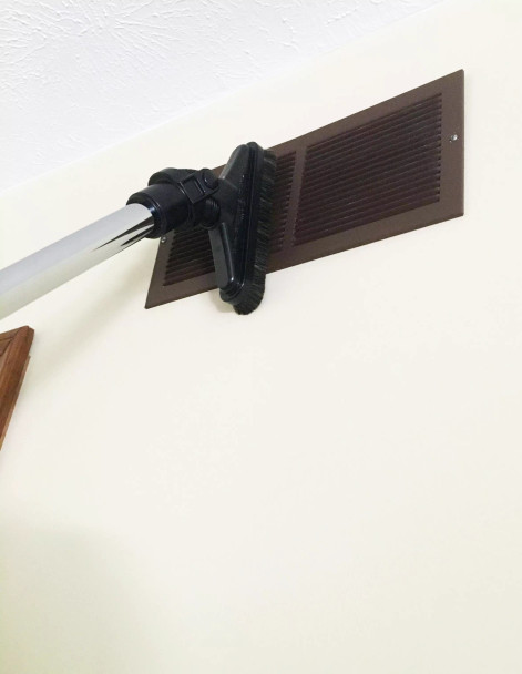 8 inch Sidewinder brush cleaning an AC vent.