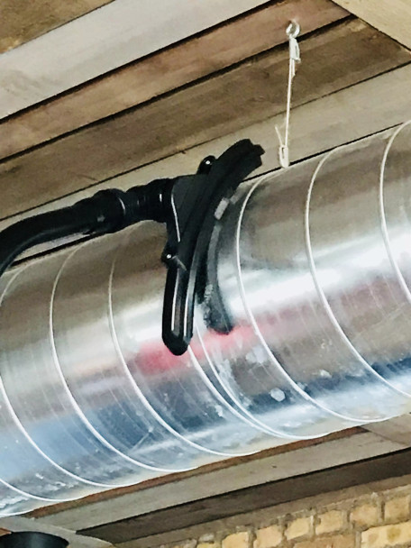 Ventilation tool cleaning ventilation duct in a restaurant.