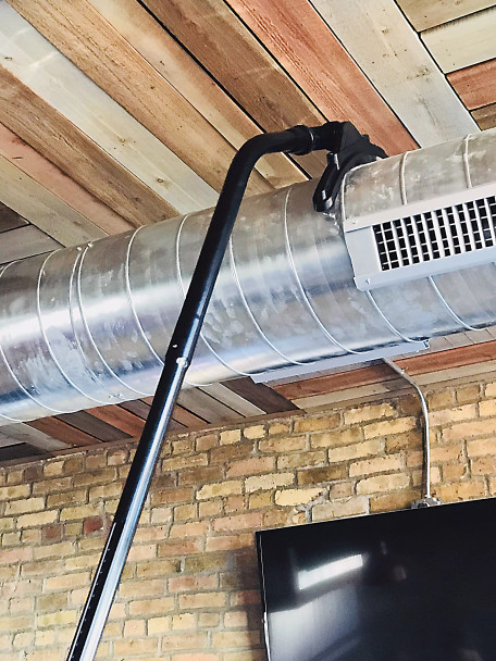 Ventilation tool cleaning ventilation duct in a restaurant.