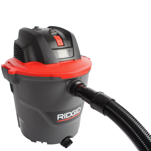 Hose connected to a utility vacuum.