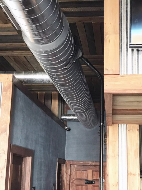 Ventilation tool cleaning ventilation duct in a restaurant.