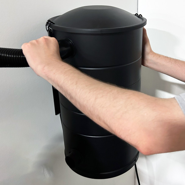 Person installing vacuum hose on the side of Aeon vacuum. Person installing vacuum hose on the side of Aeon vacuum.