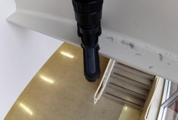 Top down view of Reach with Sidewinder cleaning metal beam.