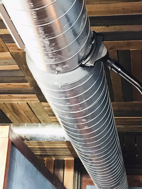 Ventilation tool cleaning ventilation duct in a restaurant.