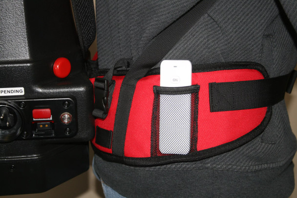 On/off remote sitting in backpack vacuum harness.