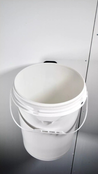 Bucket mounted onto wall.