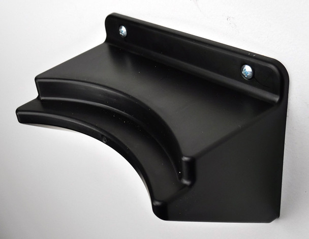 Bottom wall mount piece on white wall.