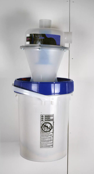 Quick Click separator bucket mounted onto white wall.