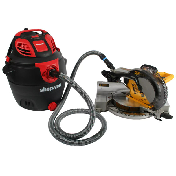 Vacuum hose connected to miter saw and utility vacuum. Vacuum hose connected to miter saw and utility vacuum.