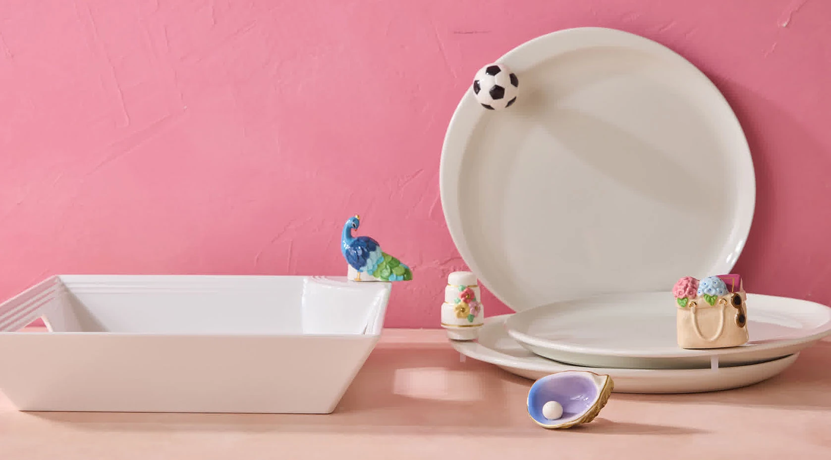 Nora Fleming platters and interchangeable minis in a styled collection display