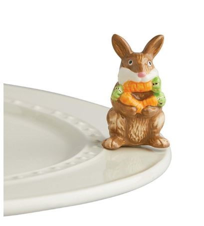 Nora Fleming's New "Funny Bunny" mini shows a bunny with an armload of carrots - and one in his mouth! Adorable for Easter, spring celebrations, and perfect any time of the year for any Nora Fleming serving piece or platter.