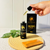 Open bottle of Mane Growth Elixir with dropper