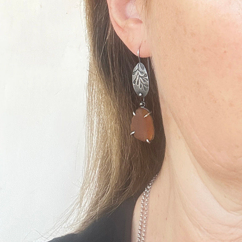 Dark amber sea glass and silver embossed frond earrings