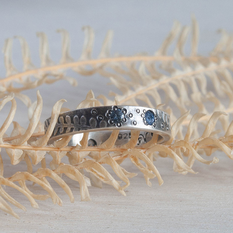 Narrow silver fern ring with sapphires