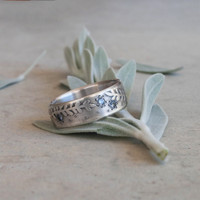 Silver fern fossil ring with sapphires