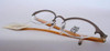 Jean Paul Gaultier 0013 Half Rim Oval Spectacles In A Bronze Finish 48mm Lens Size