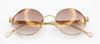 Stunning Sunglasses By Les Pieces Uniques SPACE Titanium Oval Eyewear In A Gold Finish