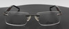 Rimless eyeglasses in silver & black with wooden temples and sprung hinges