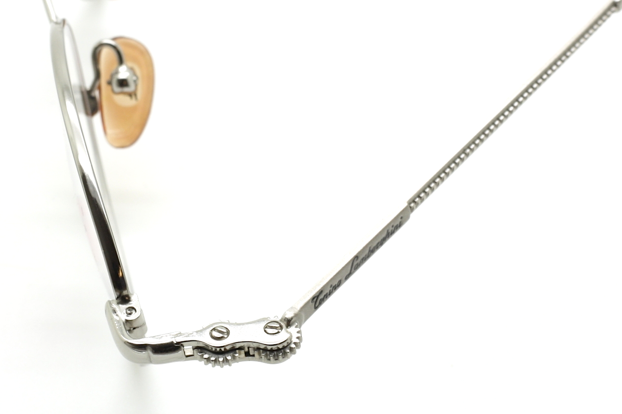 Designer Tonino Lamborghini 054 Metal Oval Cog Design Glasses In A Silver Finish With Black Ear Pieces