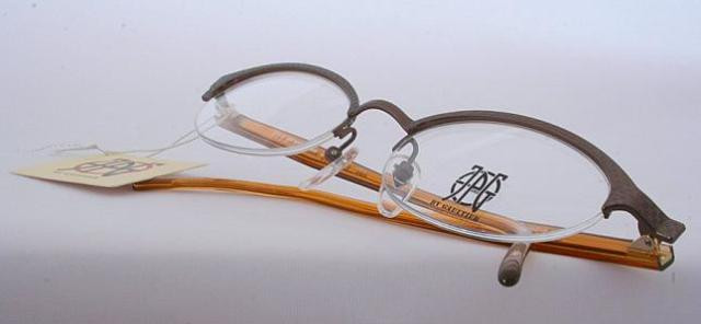 Jean Paul Gaultier 0013 Half Rim Oval Spectacles In A Bronze Finish 48mm Lens Size