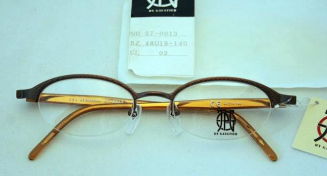 Jean Paul Gaultier 0013 Half Rim Oval Spectacles In A Bronze Finish 48mm Lens Size