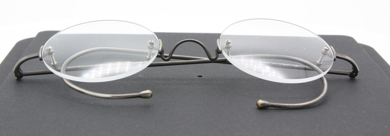 Antique Silver Rimless True Round EyeGlasses By Beuren With Saddle Bridge And Curlside Arms 40mm-50mm Lens Size