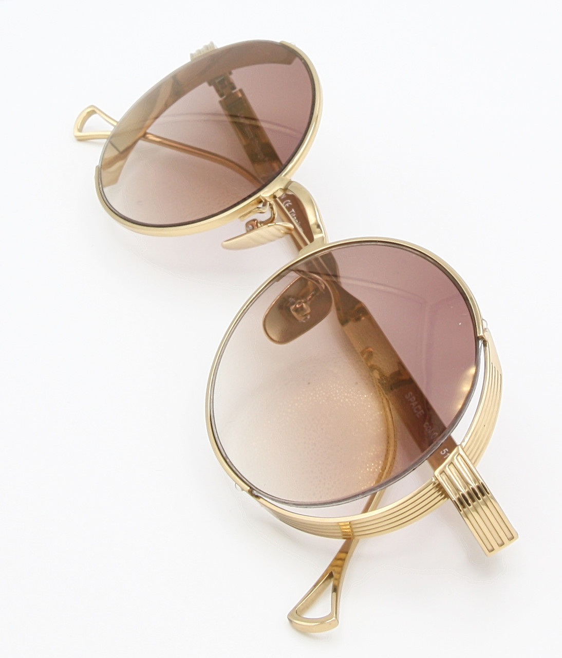 Stunning Sunglasses By Les Pieces Uniques SPACE Titanium Oval Eyewear In A Gold Finish