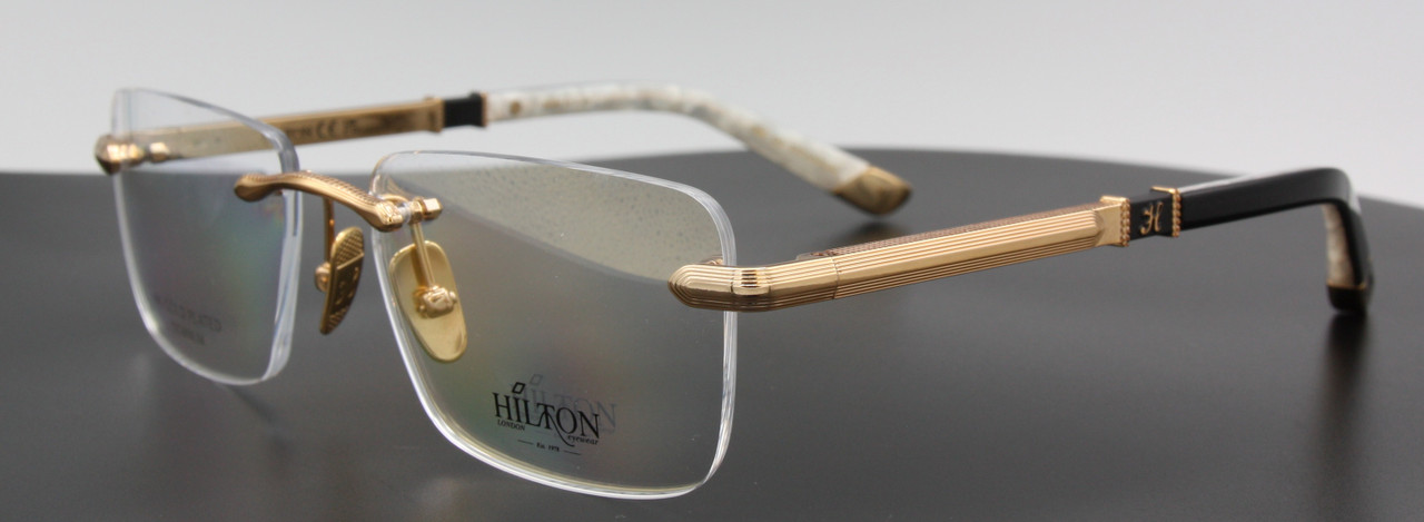Rectangular rimless glasses in 18kt gold plated titanium by Hilton Exclusive