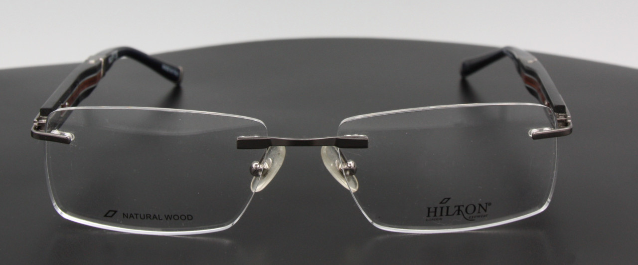 Rimless eyeglasses in silver & black with wooden temples and sprung hinges