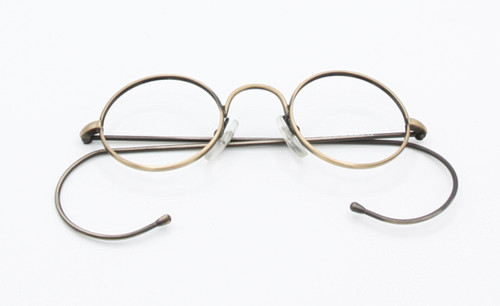 Sought-after NHS style round metal glasses in an antique gold finish, small eye sizes available at www.theoldglassesshop.co.uk