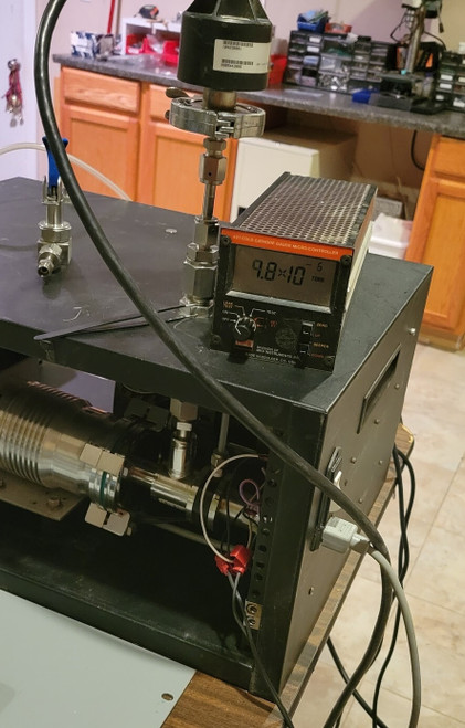 High Vacuum Reference System for Precision Applications