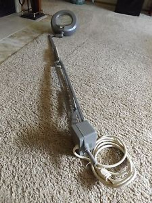 Vintage Luxo Magnifying lamp 36 arm with weighted base.